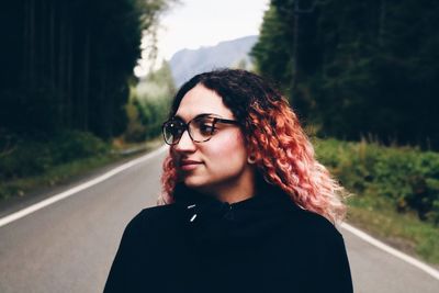 Beautiful young woman on road