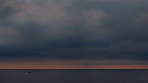 Scenic view of sea against sky at sunset