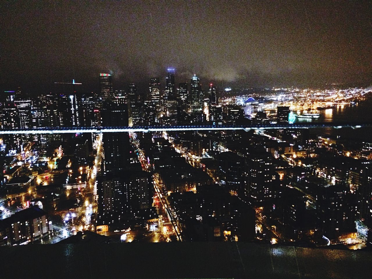 night, illuminated, cityscape, city, building exterior, architecture, built structure, high angle view, crowded, residential district, city life, river, residential building, dark, lighting equipment, modern, clear sky, skyscraper, sky, residential structure