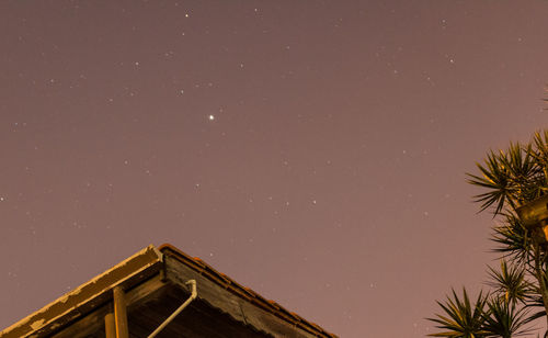 Low angle view of building against sky at night