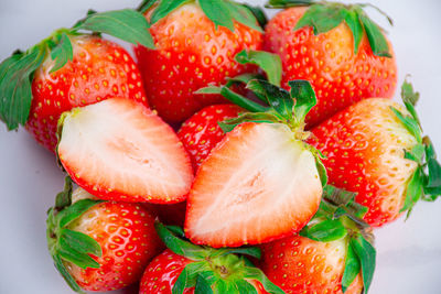 High angle view of chopped strawberries on table