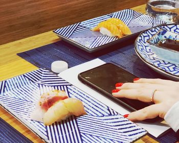 High angle view of person preparing food on table