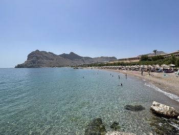 Scenic view of sea against clear blue sky