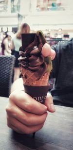 Close-up of woman holding ice cream