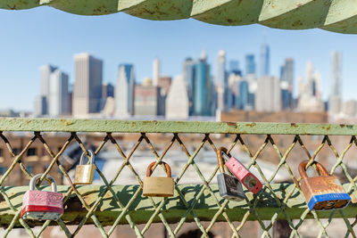 Close-up of padlocks on chainlink fence