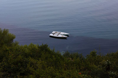 High angle view of boats in calm lake