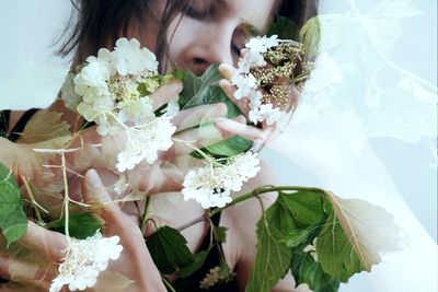 Midsection of woman with flower bouquet