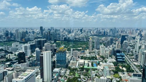 Aerial view of cityscape against sky