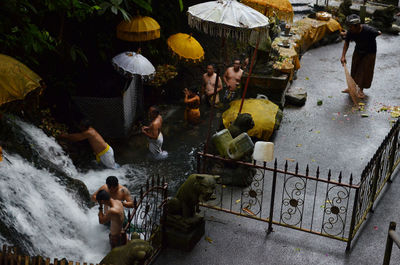 High angle view of people by waterfall