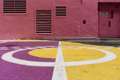 Close up of backyard with purple and yellow ground markings