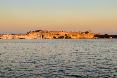 Scenic view of sea against clear sky during sunset