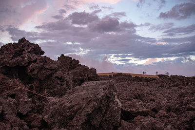 Rock formations on landscape against sky