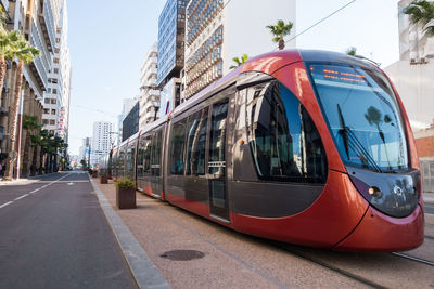 Cable car amidst buildings in city