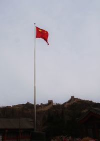 Low angle view of flag against sky