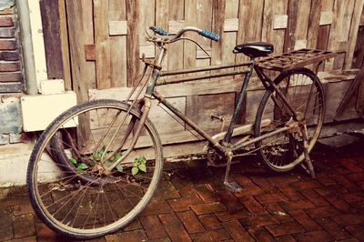 Bicycle parked against wall