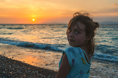 Portrait of girl on beach during sunset