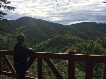 Rear view of woman looking at mountains