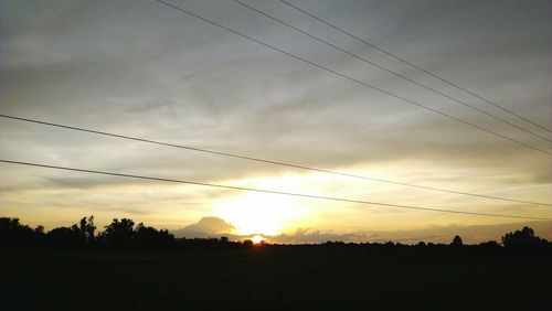 Silhouette landscape against sky during sunset