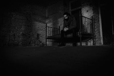 Man in corridor of building