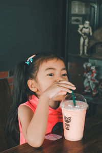 Portrait of a boy drinking glass