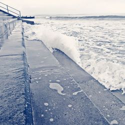 Scenic view of sea against sky during winter