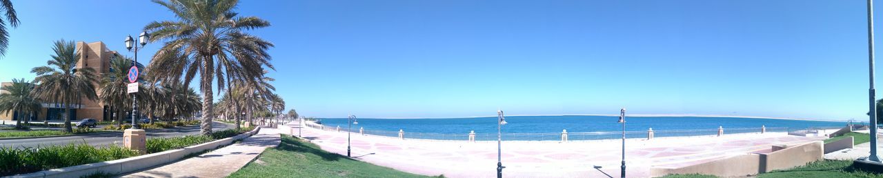 Panoramic view of sea against blue sky