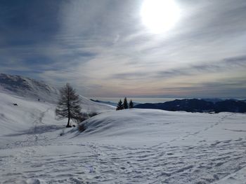 Scenic view of snow covered landscape against sky