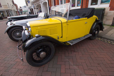 Yellow car parked on street