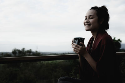 Young woman using mobile phone