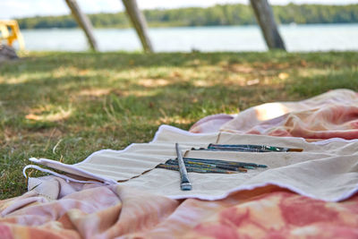 Midsection of man relaxing on field