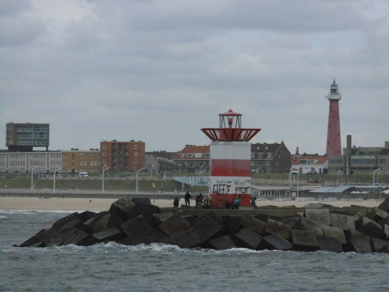 SCENIC VIEW OF SEA WITH LIGHTHOUSE IN BACKGROUND