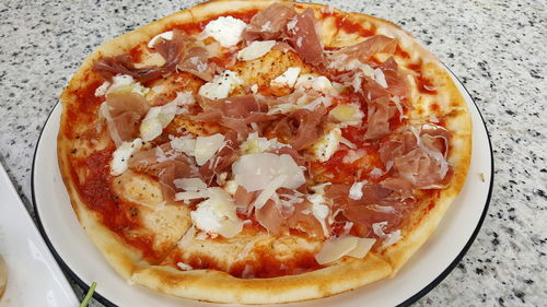 High angle view of pizza in plate on table