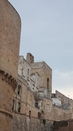 Low angle view of old building against sky