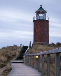 Panoramic image of kampen lighthouse against evening sky, sylt, north frisia, germany