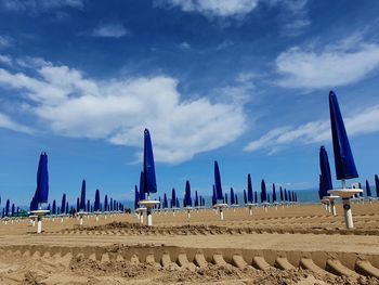 Panoramic view of beach against blue sky