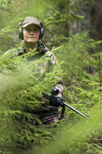 Woman hunting in forest