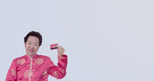 Full length of man standing against white background