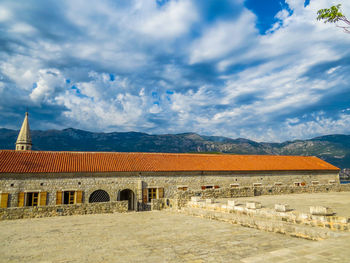 View of building against cloudy sky