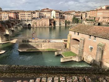 High angle view of river amidst buildings in city