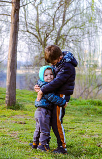 Two little brothers hugging each other 