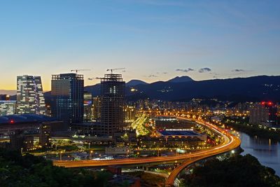 High angle view of illuminated buildings in city against sky