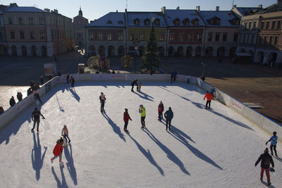 High angle view of people in town square during winter