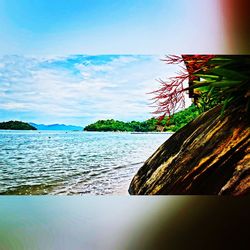 Scenic view of sea against cloudy sky