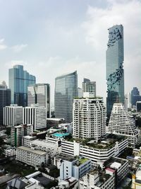 Modern buildings in city against sky