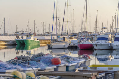 Boats moored at harbor