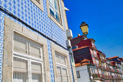 Low angle view of buildings against clear blue sky