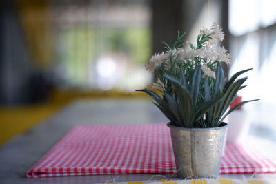 Close-up of flower vase on table