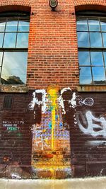 Low angle view of graffiti on wall of building