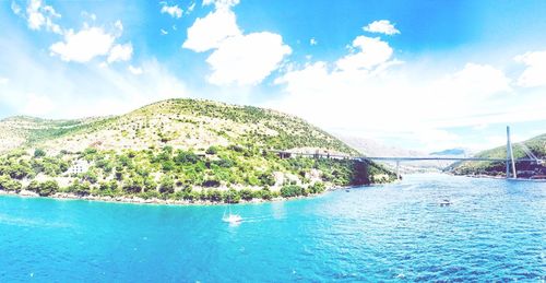 Scenic view of sea against blue sky