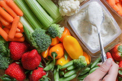 Close-up of hand holding vegetables